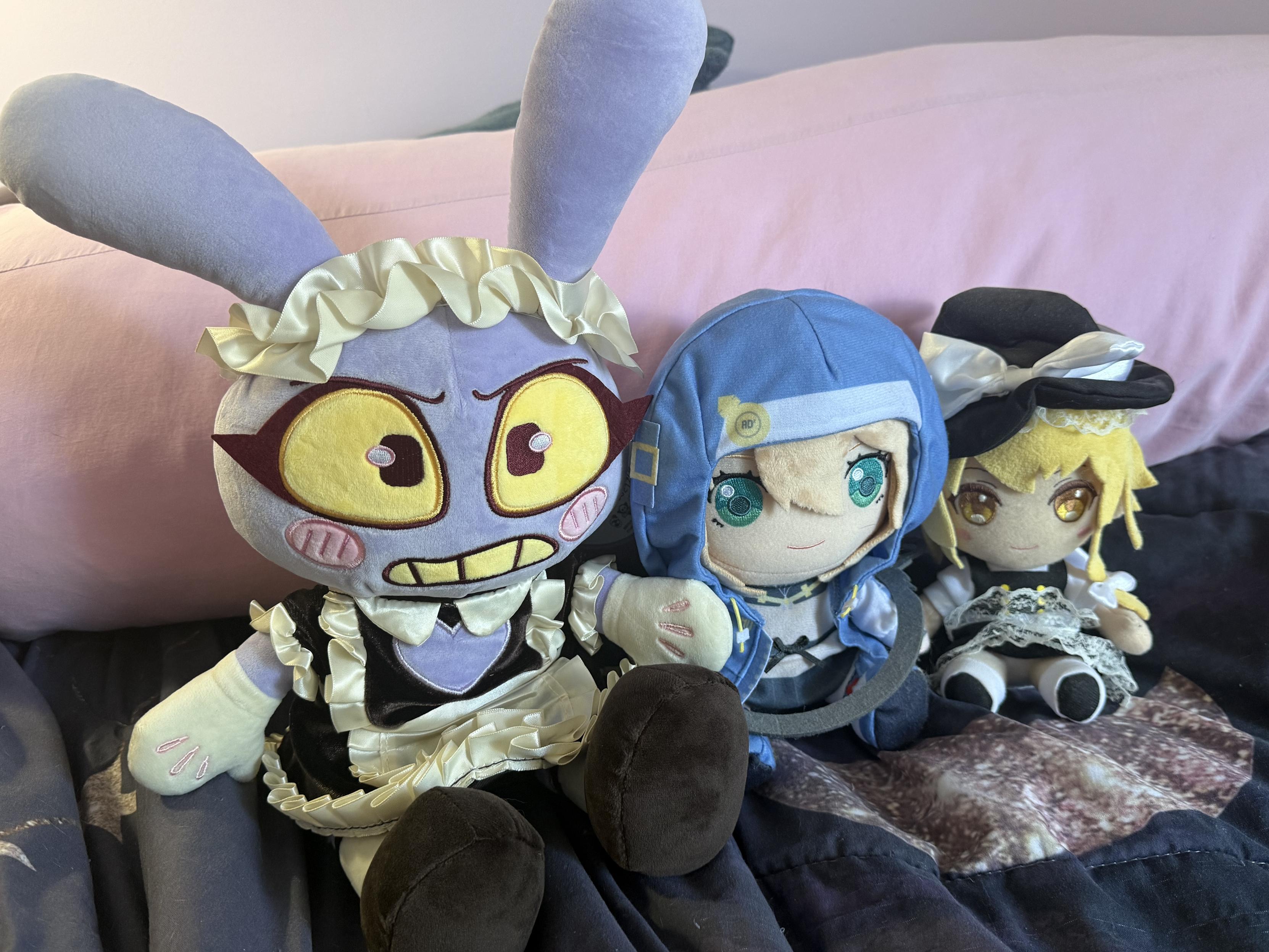 plushies of Jax from Digital Circus in a maid outfit, Bridget from Guilty Gear Strive, and Marisa Kirisame from Touhou Project